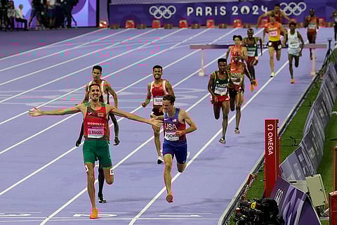 Soufiane El Bakkali, of Morocco, celebrates after winning the men's 3000-meters steeplechase final